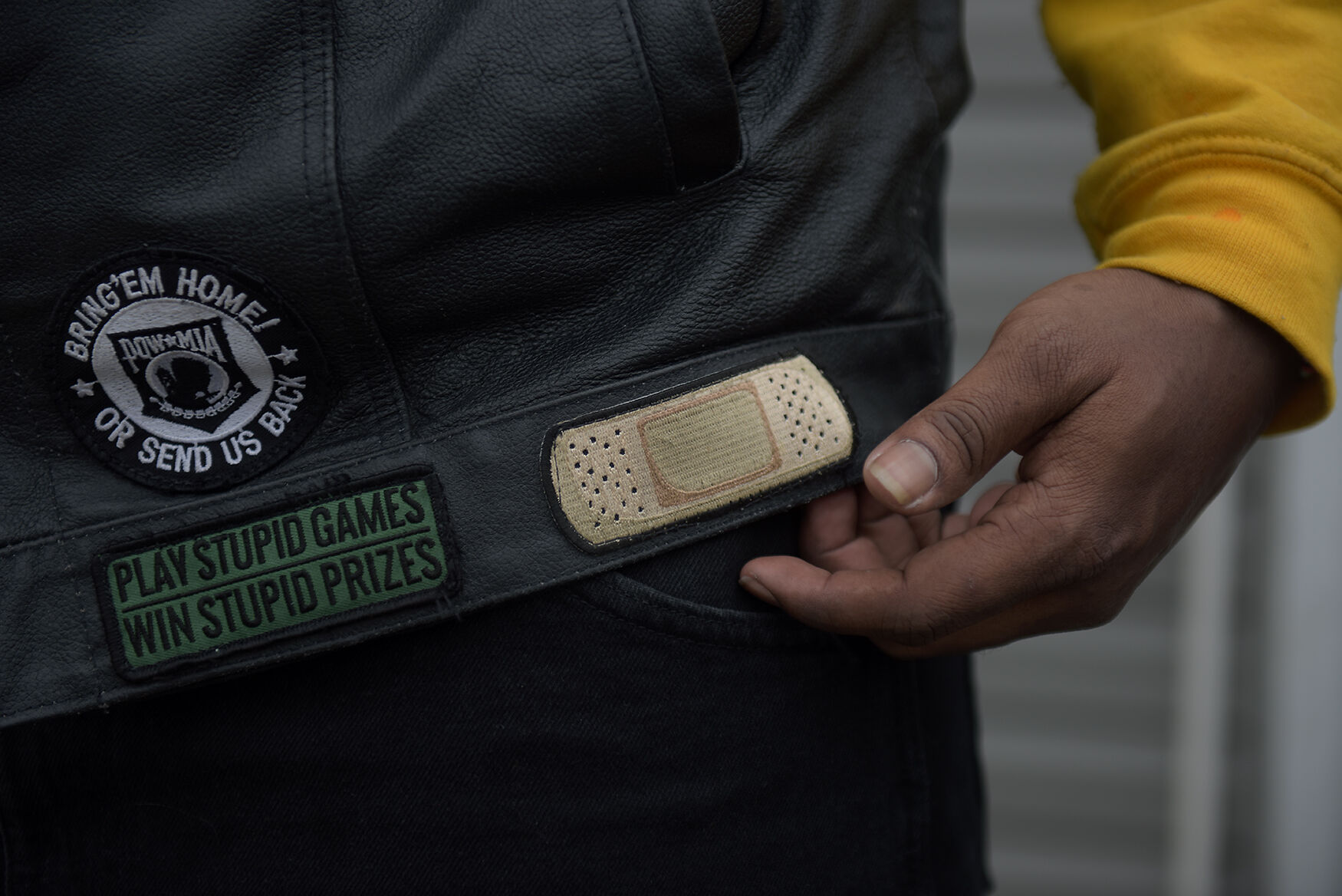 Holman shows off one of his patches on his leather vest